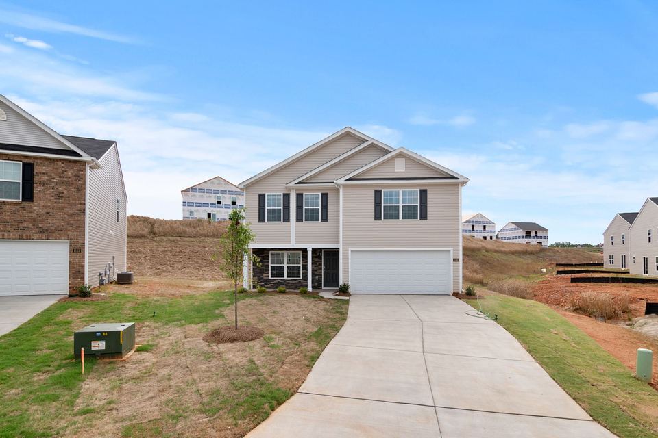 Concrete driveway leading to a residential garage